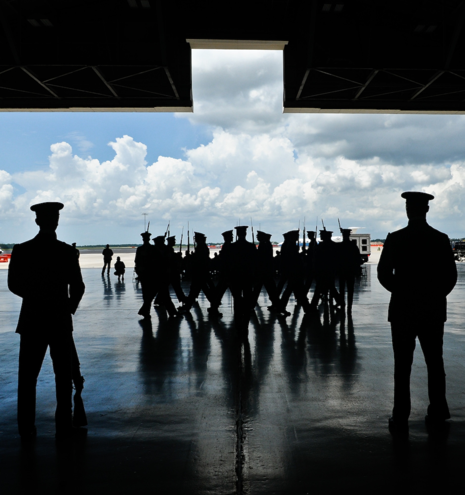 The United States Air Force Honor Guard Drill Team performs inside a hangar Aug. 25, at MacDill Air Force Base, Fla. This was a short stop for the team with only two more stops in Florida before heading to the West Coast where they will continue to showcase military precision and teamwork with their complex drill routine. (U.S. Air Force photo by Senior Airman Alexandre Montes) 