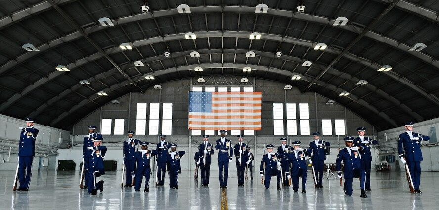 The United States Air Force Honor Guard Drill Team performs inside a hangar Aug. 25, at MacDill Air Force Base, Fla. This was a short stop for the team with only two more stops in Florida before heading to the West Coast where they will continue to showcase military precision and teamwork with their complex drill routine. (U.S. Air Force photo by Senior Airman Alexandre Montes) 