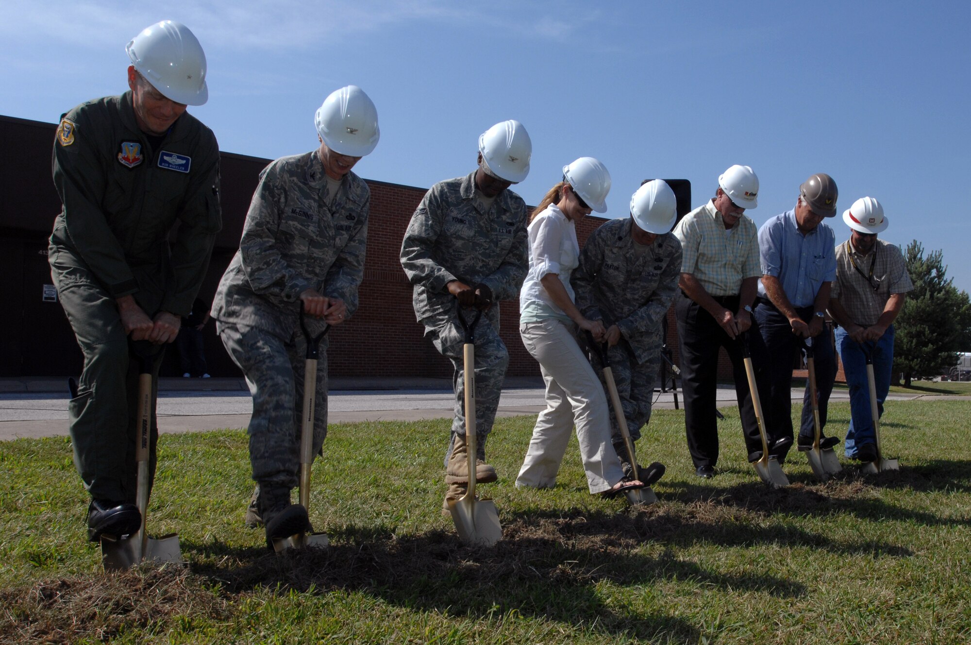 WHITEMAN AIR FORCE BASE, Mo. - Brig. Gen. Robert Wheeler, 509th Bomb Wing commander, members of the Army Corps of Engineers and other Team Whiteman members break ground on the new combined 509th Communications Squadron building here Aug. 25. The building will house all 509th CS personnel on base. (U.S. Air Force photo/Senior Airman Kenny Holston)