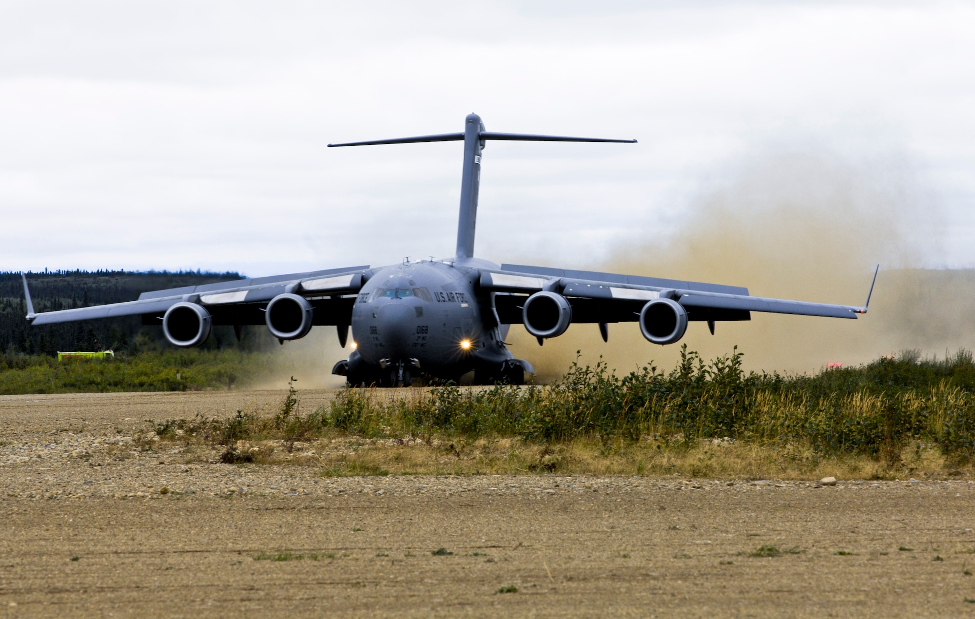DONNELLY LANDING ZONE, Alaska -- A 517th Airlift Squadron C-17 Globemaster III executes a semi-prepared runway operation landing here Aug.24. Elmendorf's 517th and Kulis Air National Guard's 249th airlift squadrons participated in the Army's Operation Arctic Response Aug. 24 and 26. The airlift squadrons flew two C-17s to help deploy 120 Soldiers and supplies to the remote site. (U.S. Air Force photo/Airman 1st Class Christopher Gross)