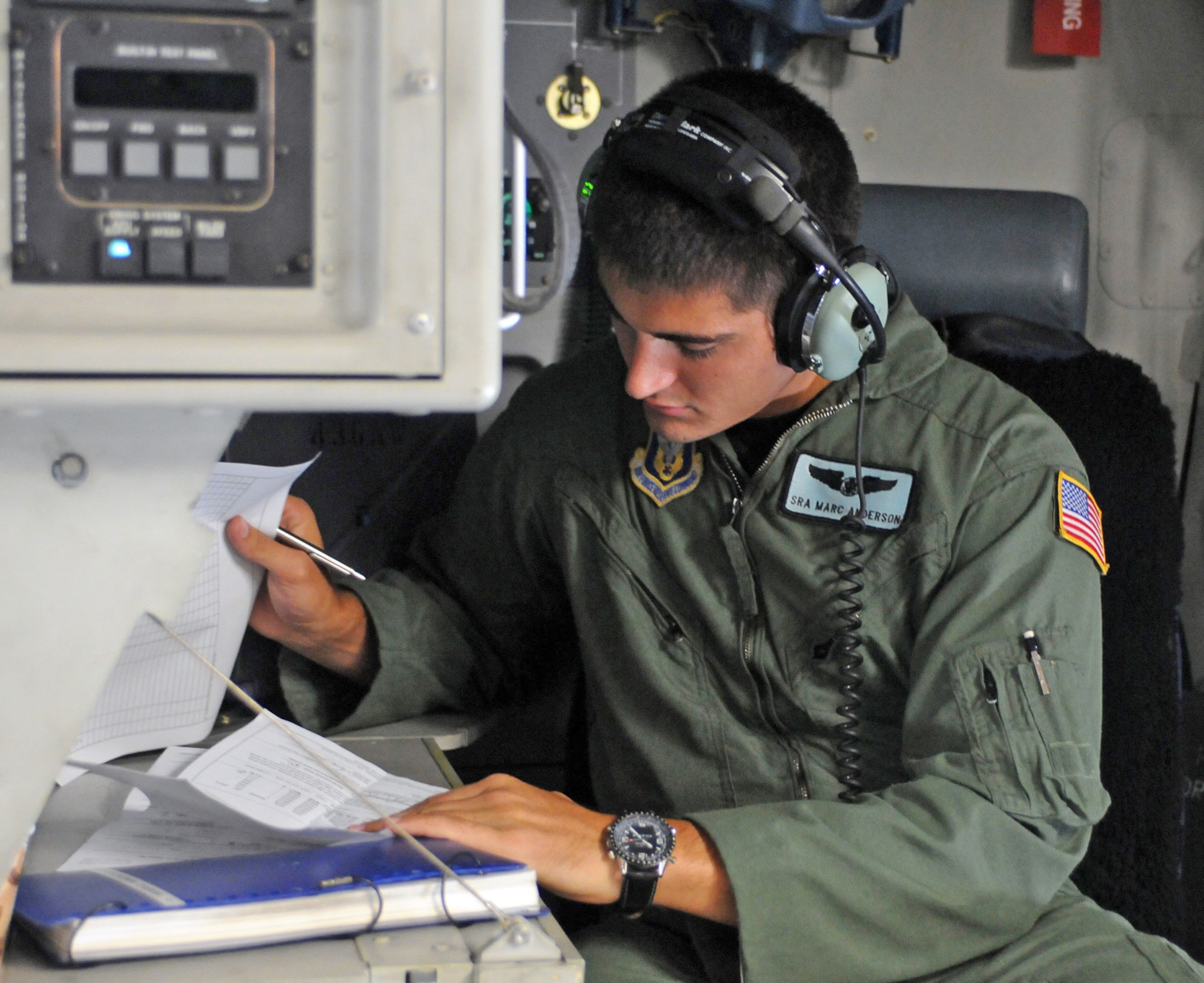 Senior Airman Marc Anderson, a C-17 Globemaster III loadmaster with the Air Force Reserve Command's 512th Airlift Wing at Dover Air Force Base, Del., completes weights and balances paperwork Aug. 22 to ensure the aircraft is properly configured prior to take off.  The aircraft was flying to Canadian Forces Base Trenton in Ontario, where the Dover reservists would spend three days with Royal Canadian Air Force members to forge a partnership and identify future training opportunities for flying, aerial port operations, airlift control and maintenance procedures. (U.S. Air Force photo/Capt. Marnee A.C. Losurdo)