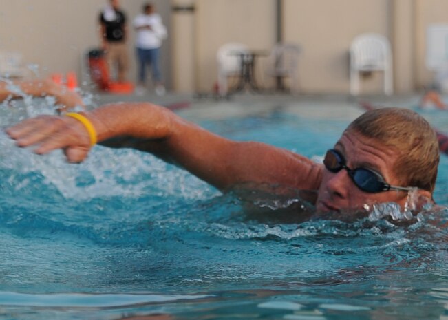 Steve Hart performs the 450-meter swimming portion of a triathlon held here Aug. 22. Hart finished his swim with a time of 11 minutes, 10 seconds and placed 16th in the triathlon out of 54 competitors. The fitness center held the seventh annual triathlon to test people's fitness and allow healthy activity. (U.S. Air Force photo/Senior Airman Katie Gieratz)
