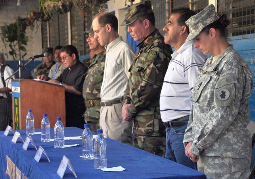 SAN FERNANDO, El Salvador – Col. Guillermo Escobar, 4th Brigade commander, Salvadoran army; Robert Blav, U.S. Embassy in El Salvador business representative; Col. Roberto Artiga Chicas, 4th Brigade Deputy commander, Salvadoran army; Rodolfo Alvarez, mayor of San Fernando and Lt. Col. Marie Dominguez, Medical Element commander, Joint Task Force-Bravo, participate in a moment of silence in the opening ceremony of a Medical Readiness Training Exercise, or MEDRETE, here Aug. 25. During the two-day MEDRETE here a combined U.S. and Salvadoran team provides free medical care to the members of the village. In the MEDRETE’s first day, the medical team treated 364 Salvadoran patients (U.S. Air Force photo/1st Lt. Jennifer Richard).