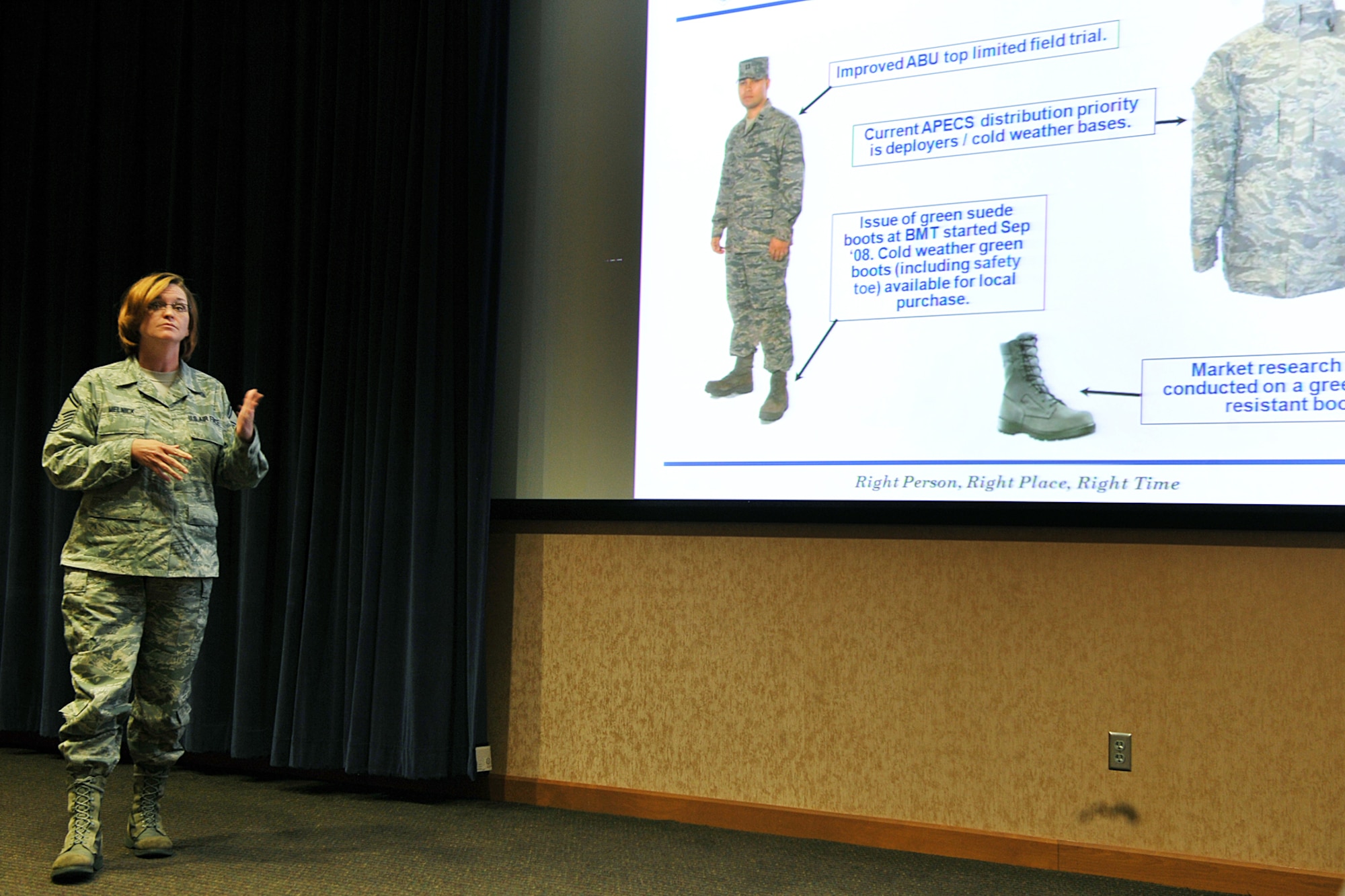 OFFUTT AIR FORCE BASE, Neb. -- Senior Master Sgt. Carianne Melnick, a member of the Air Force Personnel Center's Spread the Word briefing team, informs Team Offutt about uniform changes during the Spread the Word briefing at the Air Force Weather Agency auditorium here Aug. 24. The briefing also addressed assignments, deployments and civilian hiring procedures. U.S. Air Force Photo by Charles Haymond