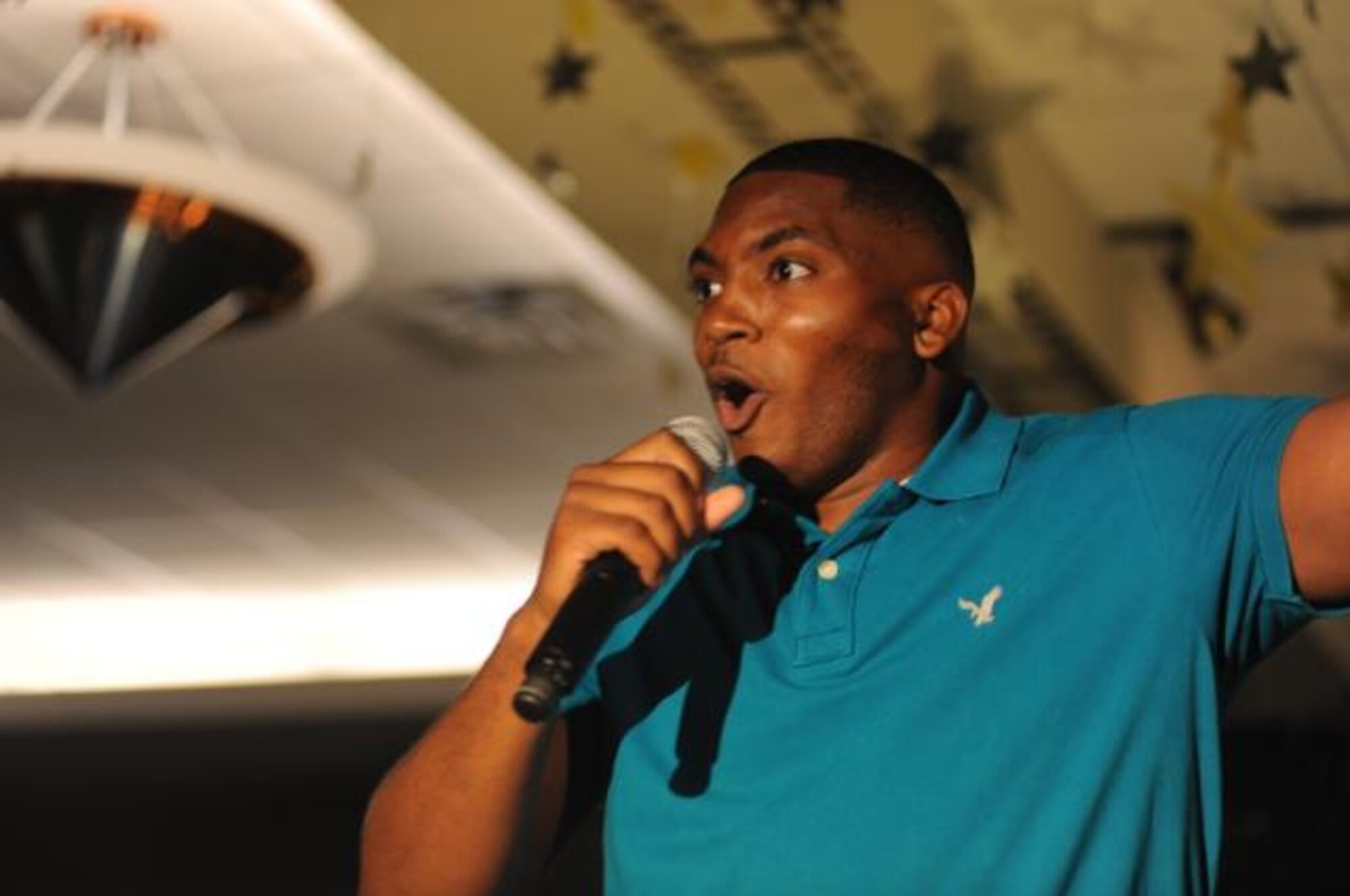 Airman Marshall Merriweather, 319th Logistics Readiness Squadron, performs "Mustang Sally" August 20 during the 2009 Grand Forks Air Force Base AMC Icon competition at the Northern Lights Club. Airman Merriweather took first place in the competition and will represent the base at the AMC-wide competition at Scott AFB, Ill. (U.S. Air Force photo by Staff Sgt. Suellyn Nuckolls).