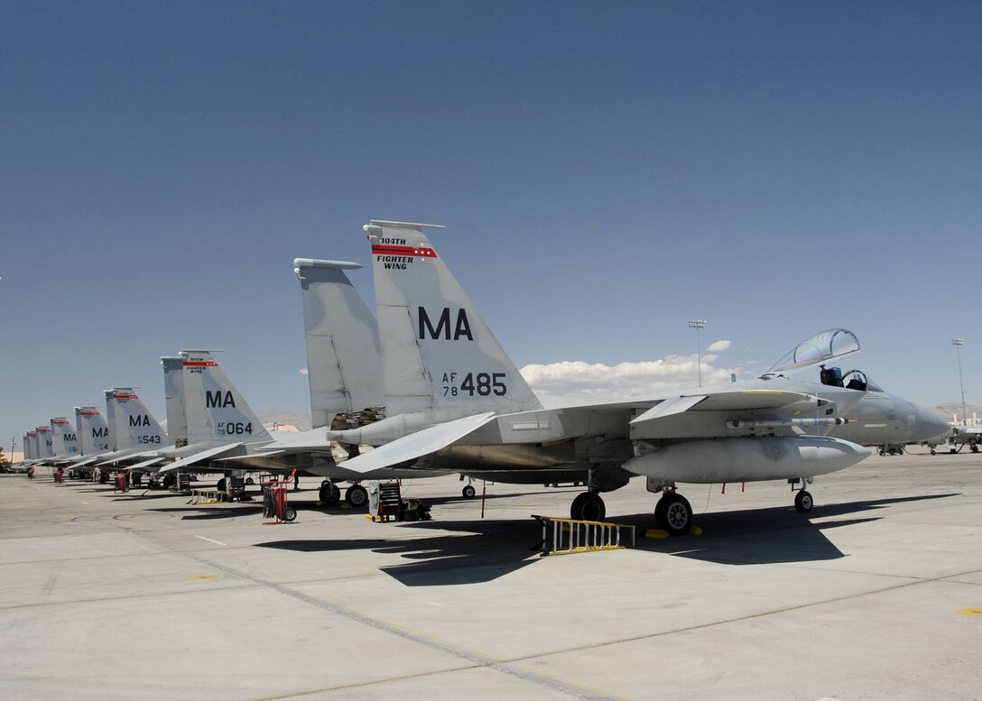 F-15 Eagles from the Massachusetts Air National Guard's 104th Fighter Wing at Barnes Air National Guard Base in Westfield, Mass., lined up on the Nellis Air Force Base, Nev., Aug. 25 while participating in a Red Flag exercise.  Red Flag offers pilots and ground crews training in actual wartime scenarios to increase their combat skills.  (U.S. Air Force photo/Senior Master Sgt. Robert J. Sabonis)
