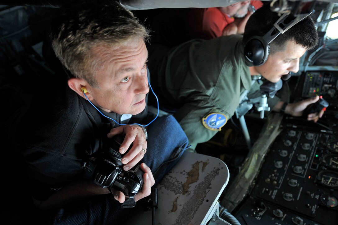 Wayne Roberts, vice president of Pioneer Balloon in Wichita, Kan., looks out from the boom pod of an in-flight KC-135 Stratotanker assigned to McConnell Air Force Base, Kan. Mr. Roberts is also an honorary commander of the 22nd Maintenance Squadron at McConnell. He and other honorary commanders flew with a Reserve aircrew from the 931st Air Refueling Group during an aerial refueling mission in mid-August. (U.S. Air Force photo/Tech. Sgt. Jason Schaap)