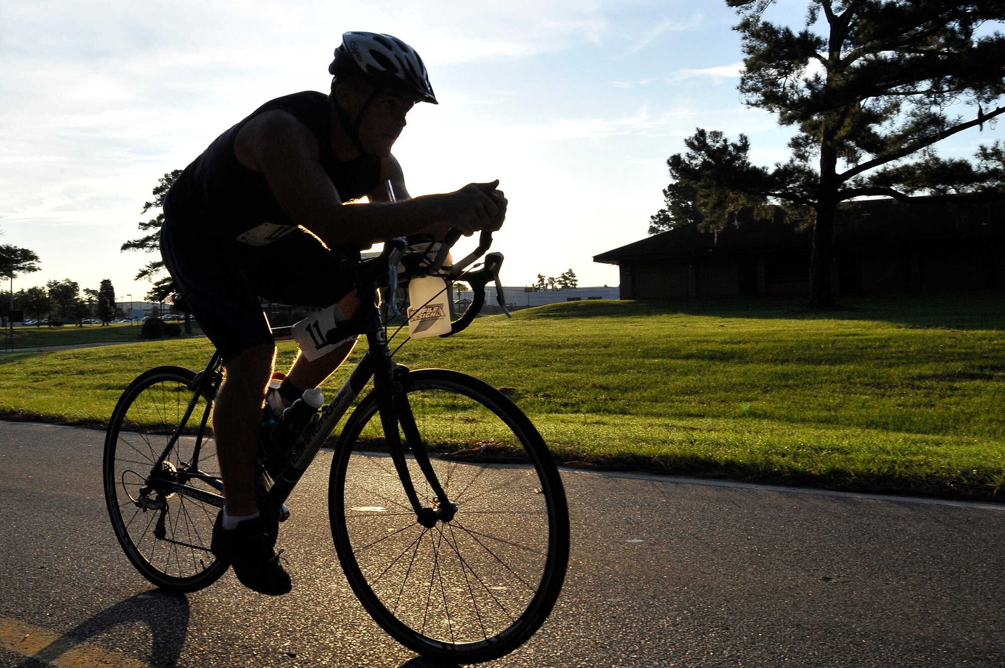 Brian Arndts approaches the finish line of the bicycling portion of a triathlon held here Aug. 22. Events for the triathlon also included a 450-meter swim and a 5,000-meter run. Arndts is a member of the Navy and is stationed at Naval Weapons Station Charleston.(U.S. Air Force photo/James M. Bowman)

