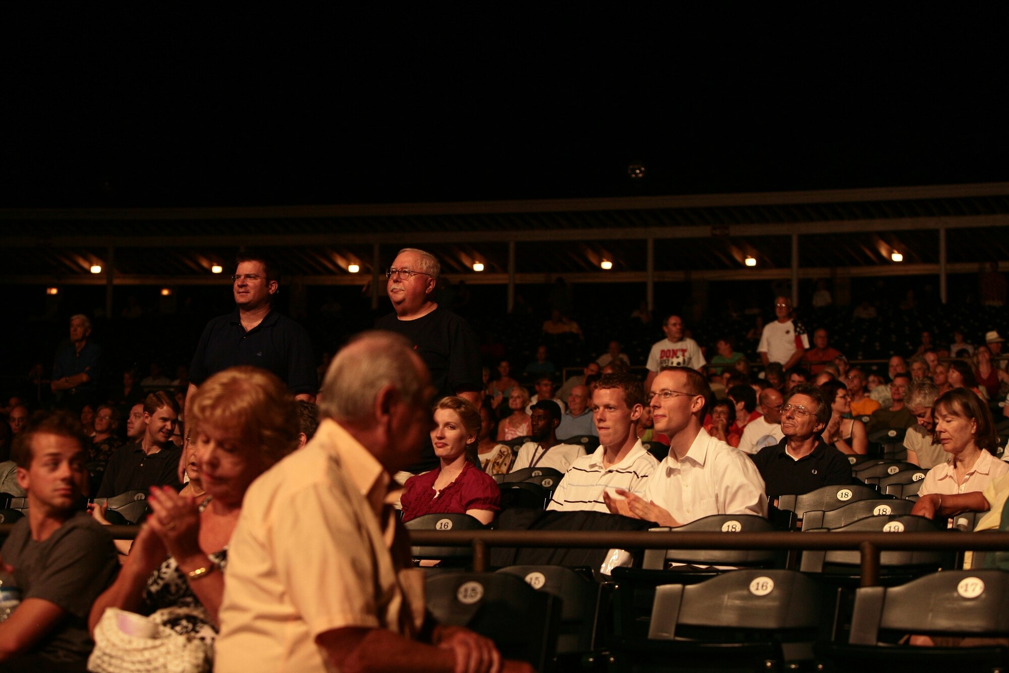 Members of the audience stand during the “Service Song Medley” at the conclusion of the 2009 Joint Service Jazz Festival.  The concert, which took place at the Carter Barron Amphitheatre on August 16th, was hosted by the Airmen of Note, and featured the Army Blues and the Navy Commodores.  (photo by SFC Mark Wood, U.S. Army Band)