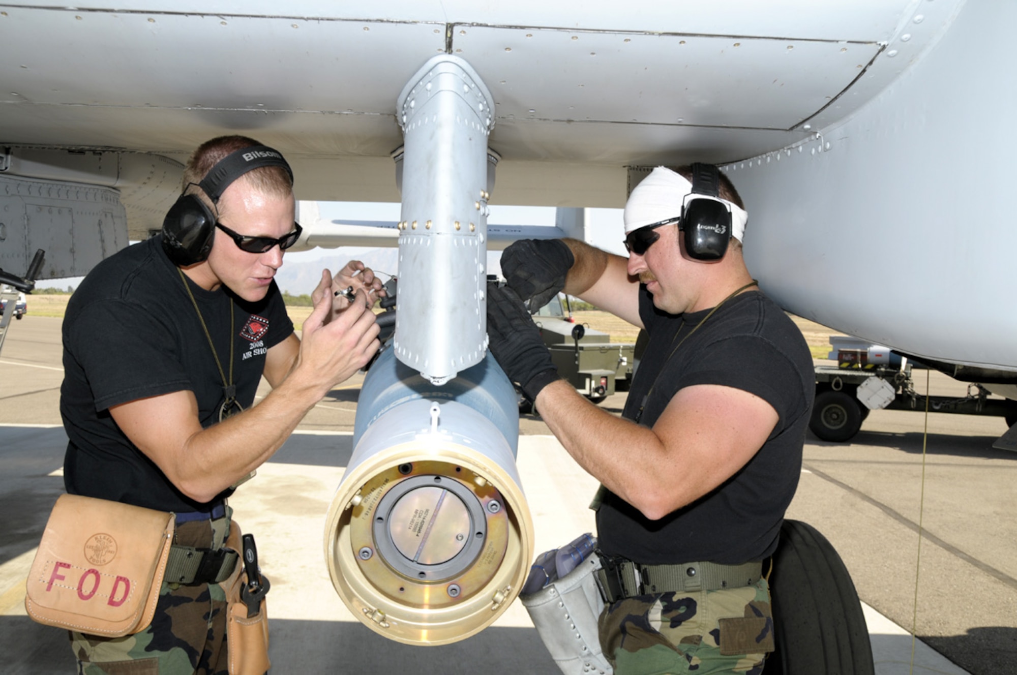 Snowbird - Maintenance personnel from the 188th Fighter Wing, Arkansas Air National Guard, based in Fort Smith, Ark., load weapons on an A-10 Thunderbolt II Warthog on the Snowbird flightline during a deployment to Davis-Monthan Air Force Base in Tucson, Ariz., July 29. The deployment helped the 188th prepare for an upcoming AEF deployment to Afghanistan (U.S. Air Force photo by Senior Master Sgt. Dennis L. Brambl)