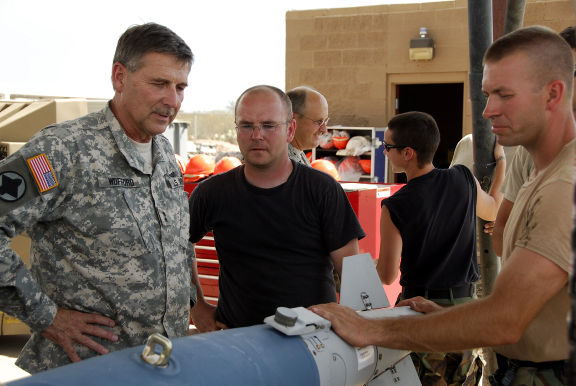 Snowbird - Maj. Gen. William Wofford, Arkansas adjutant general, talks with members of the 188th Fighter Wing, Arkansas Air National Guard, based in Fort Smith, Ark., during a civic tour to Davis-Monthan Air Force Base in Tucson, Ariz., Aug. 5. The purpose of the tour was to observe the training of 188th personnel in preparation for the unit's upcoming AEF deployment.  (U.S. Air Force photo by Tech Sgt. Stephen Hornsey)