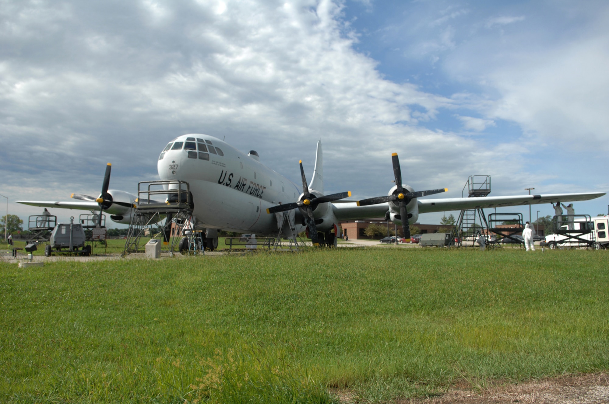 WHITEMAN AIR FORCE BASE, Mo. - Members from the 509th Maintenance and Munitions squadrons restore the protective coating on a KC-97 static display here today. The restoration, which is required every five years, is scheduled to take a month. During this time Airman will sand, repaint and perform any required sheet metal repair to the KC-97. (U.S. Air Force photo/Senior Airman Jessica Snow)