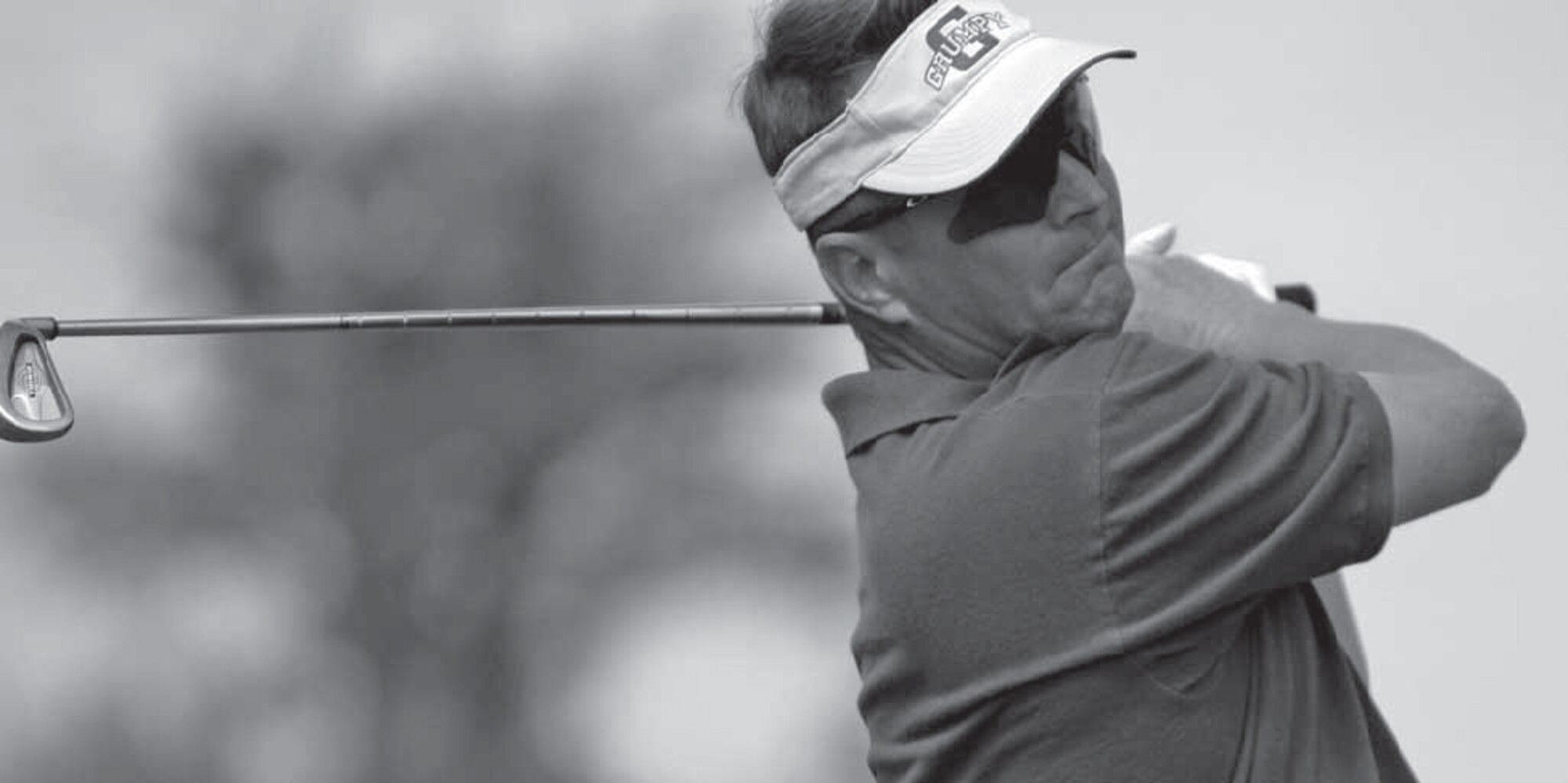 Lt. Col. Greg Harney finishes his swing while representing the 931st Air Refueliing Group in the McConnell Air Force Base Intramural Golf Championship at the base in 2004. Colonel Harney, a KC-135 Stratotanker pilot, is scheduled to again represent the 931st during this year's championship match on Aug. 28. He helped the team win championships in 2004 and 2008. 