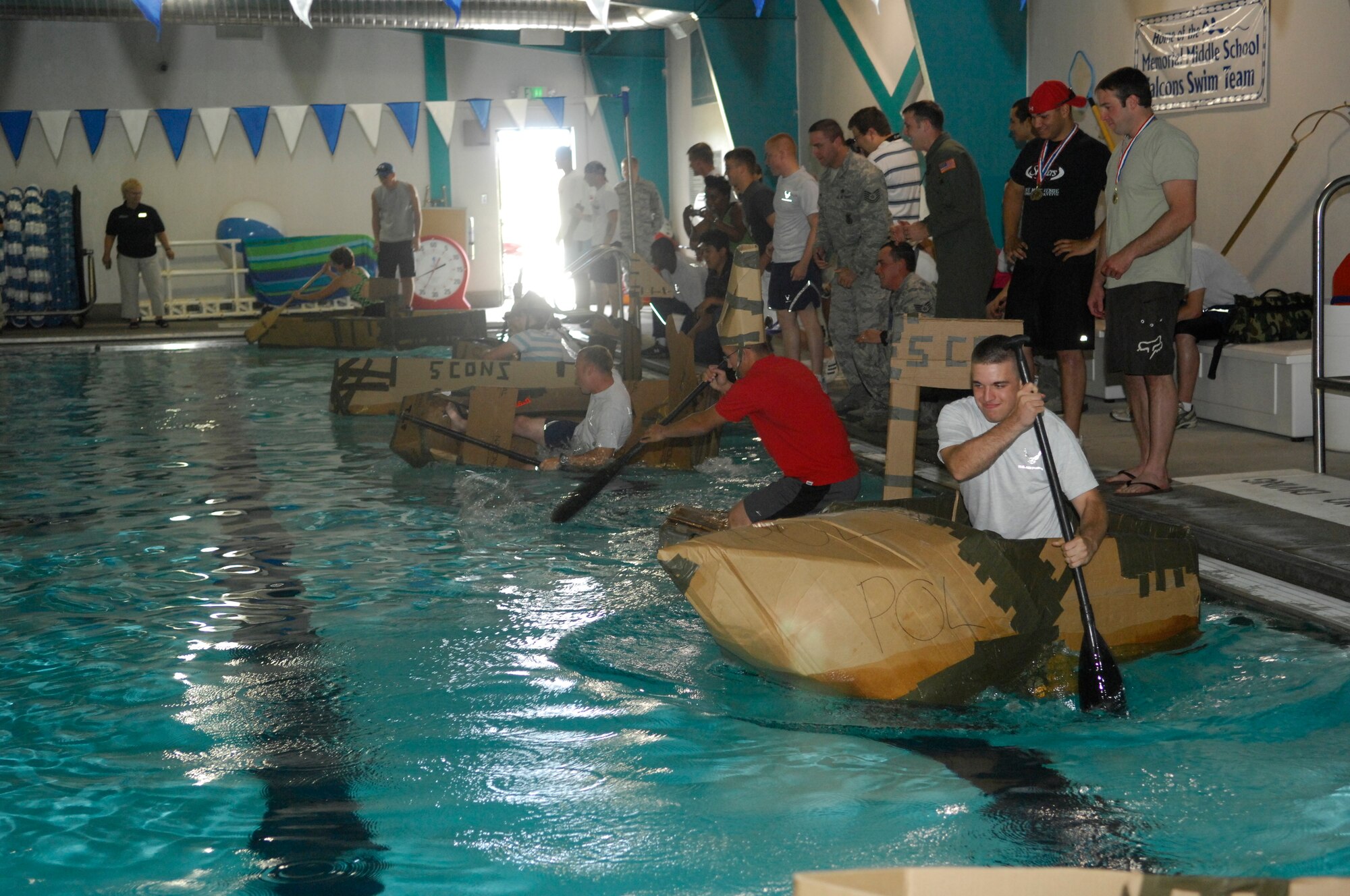 MINOT AIR FORCE BASE, N.D. -- 5th Mission Support Group Airmen compete against each other in a build-a-boat race, as part of the wing annual Summerfest here, Aug. 21. Summerfest is a morale and teambuilding program designed to test the team spirit and ingenuity of Airmen as they compete in various events for the Summerfest Championship trophy. (U.S. Air Force photo by Airman 1st Class Jesse Lopez)