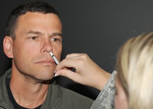 LANGLEY AIR FORCE BASE, Va. -- Col. Matt Molloy, 1st Fighter Wing commander, gets his intranasal influenza mist here Aug. 26. Everyone is required to have their flu mist and/or shot and are urged to have them done as soon as possible. (U.S. Air Force photo/Airman 1st Class Jonathan Koob)