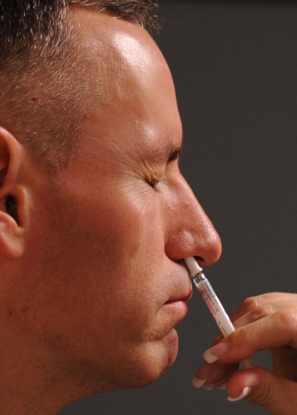 LANGLEY AIR FORCE BASE, Va. -- Col. Eric Stone, 1st Medical Group commander, gets his intranasal influenza mist here Aug. 26. Everyone is required to have their flu mist and/or shot and are urged to have them done as soon as possible. (U.S. Air Force photo/Airman 1st Class Jonathan Koob)