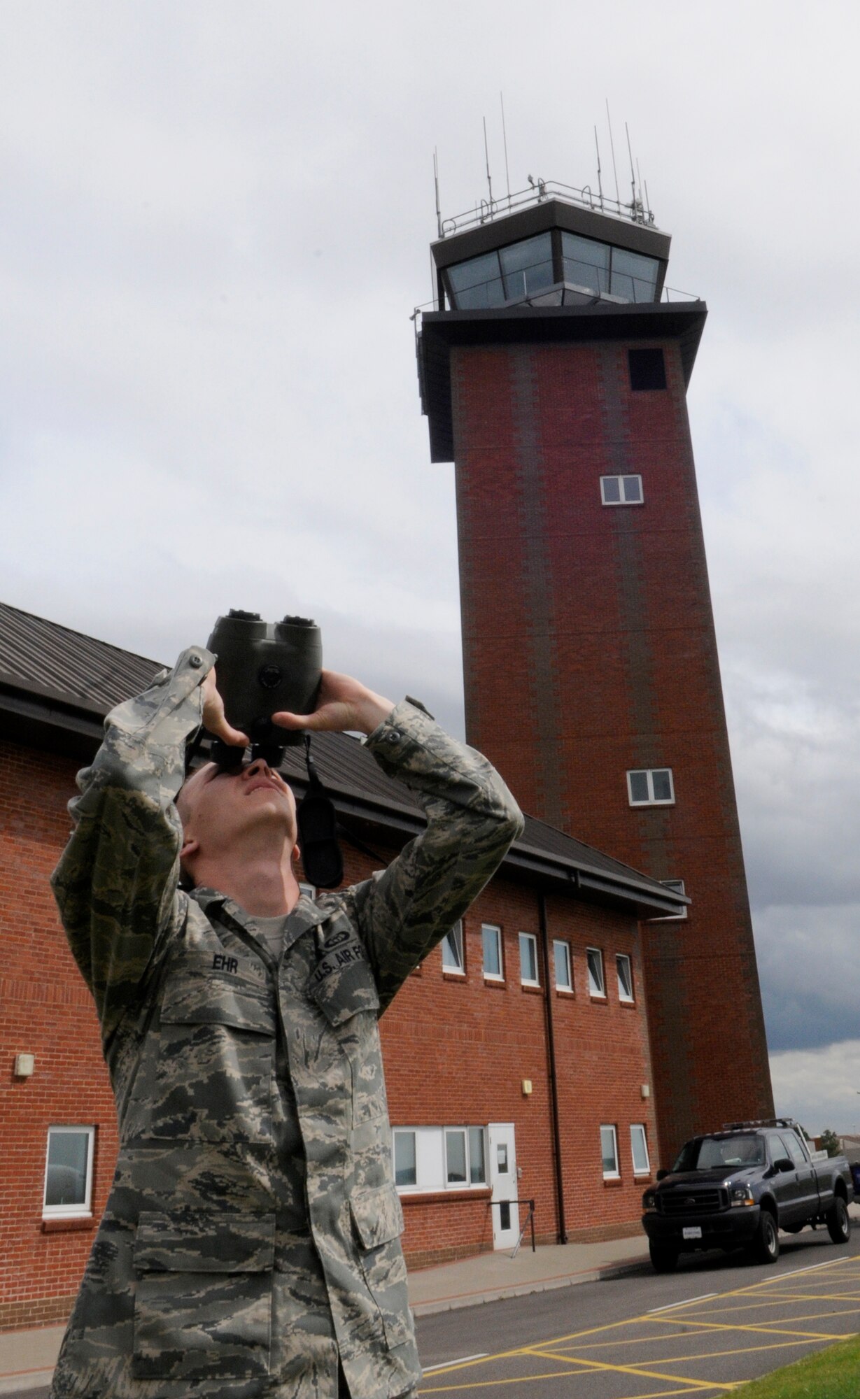 RAF MILDENHALL, England -- Staff Sgt. Dustin Ehr, 100th Operations Support Squadron weather flight, uses a digital range finder to determine cloud heights Aug. 20.  As a member of the weather flight, Sergeant Ehr is charged with providing accurate forecasts to pilots before and during missions.  (U.S. Air Force photo by Staff Sgt. Christopher L. Ingersoll)