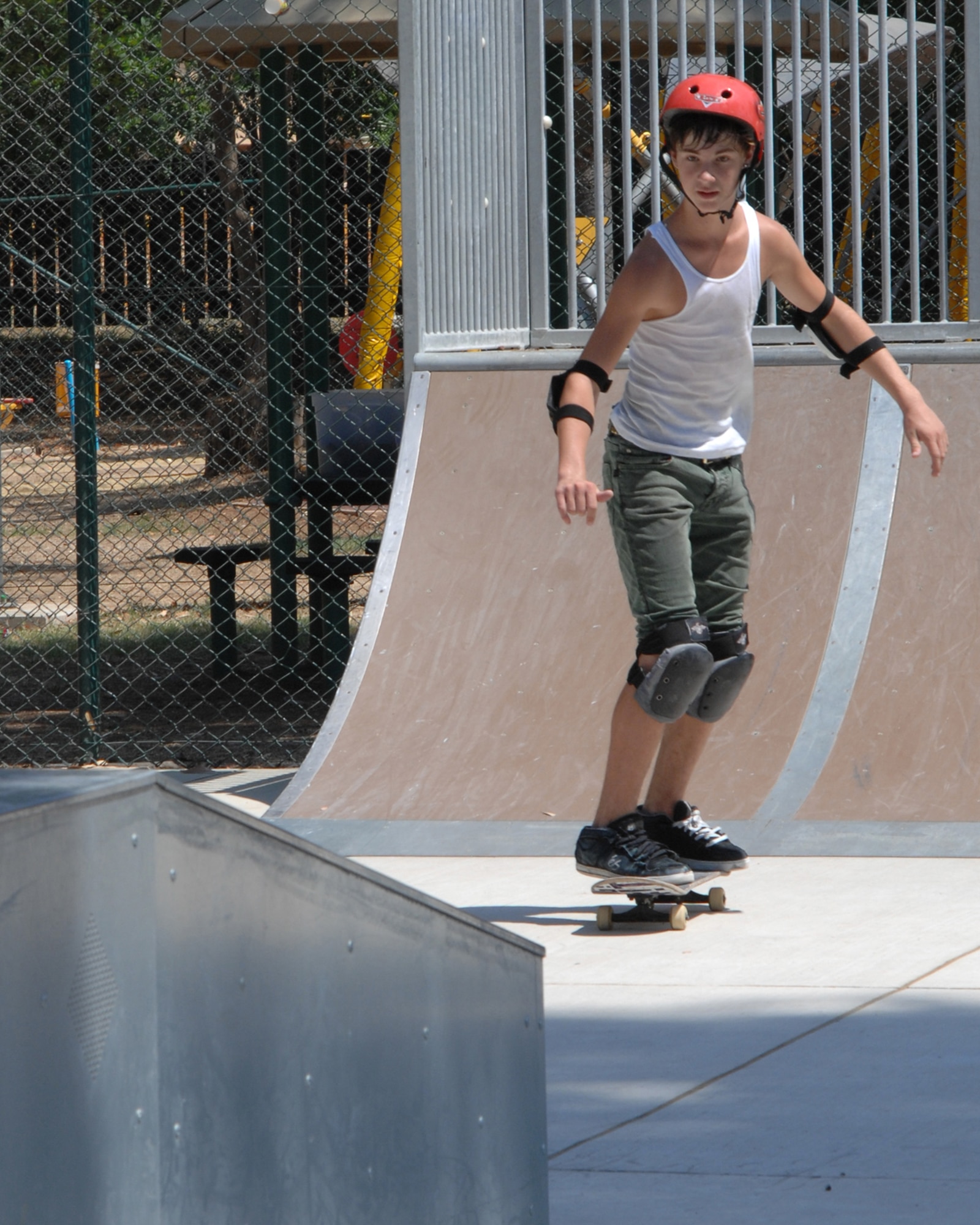 Keyton Daniels, son of at Incirlik Unit School teachers Shannon and Lady Daniels, skates down the quarter pipe to the fun box during a five-day skateboard camp at Incirlik Air Base, Turkey, Friday, Aug. 21, 2009. Pro-skateboarders Falco Baltys and Doug Des Autels taught participants skateboarding fundamentals as well as safety and advanced tricks. Mr. Baltys and Mr. Des Autels work for the Premise 3-2-1 company which has been conducting skateboard camps around the military for many years. (U.S. Air Force photo/Staff Sgt. Lauren Padden)
