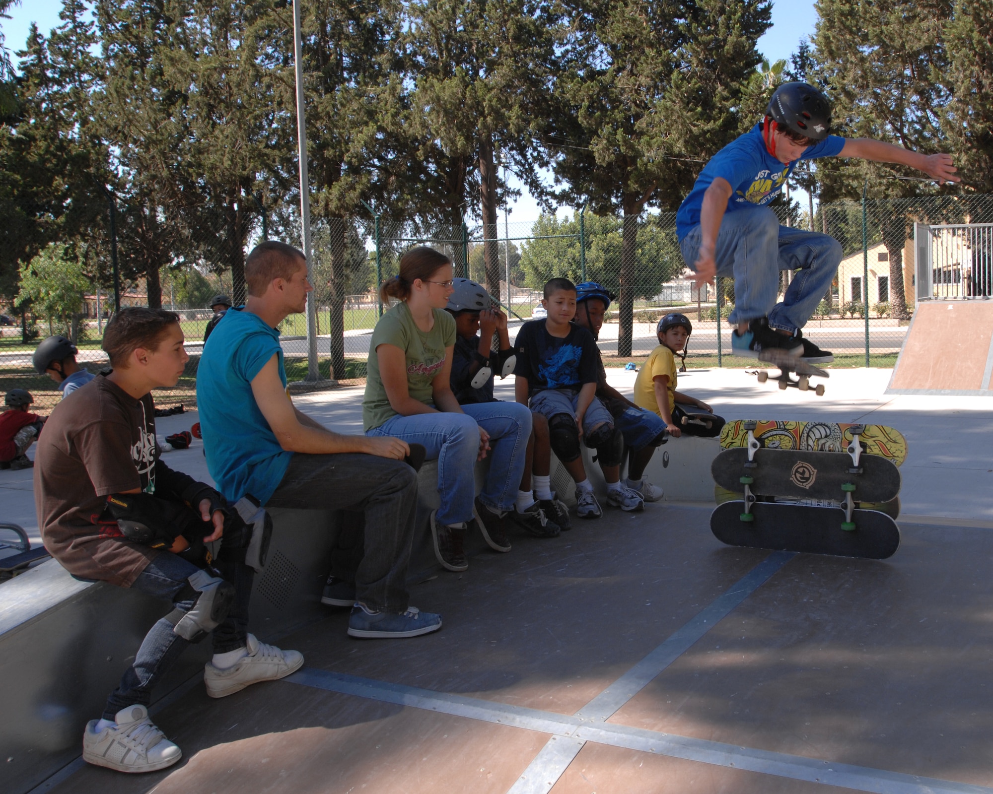Keyton Daniels, son of at Incirlik Unit School teachers Shannon and Lady Daniels, ollies over four skateboards during a five-day skateboarding camp at Incirlik Air Base Turkey, Friday, Aug. 21, 2009. Pro-skateboarders Falco Baltys and Doug Des Autels taught participants skateboarding fundamentals as well as safety and advanced tricks. Mr. Baltys and Mr. Des Autels work for the Premise 3-2-1 company which has been conducting skateboard camps around the military for many years. (U.S. Air Force photo/Staff Sgt. Lauren Padden)
