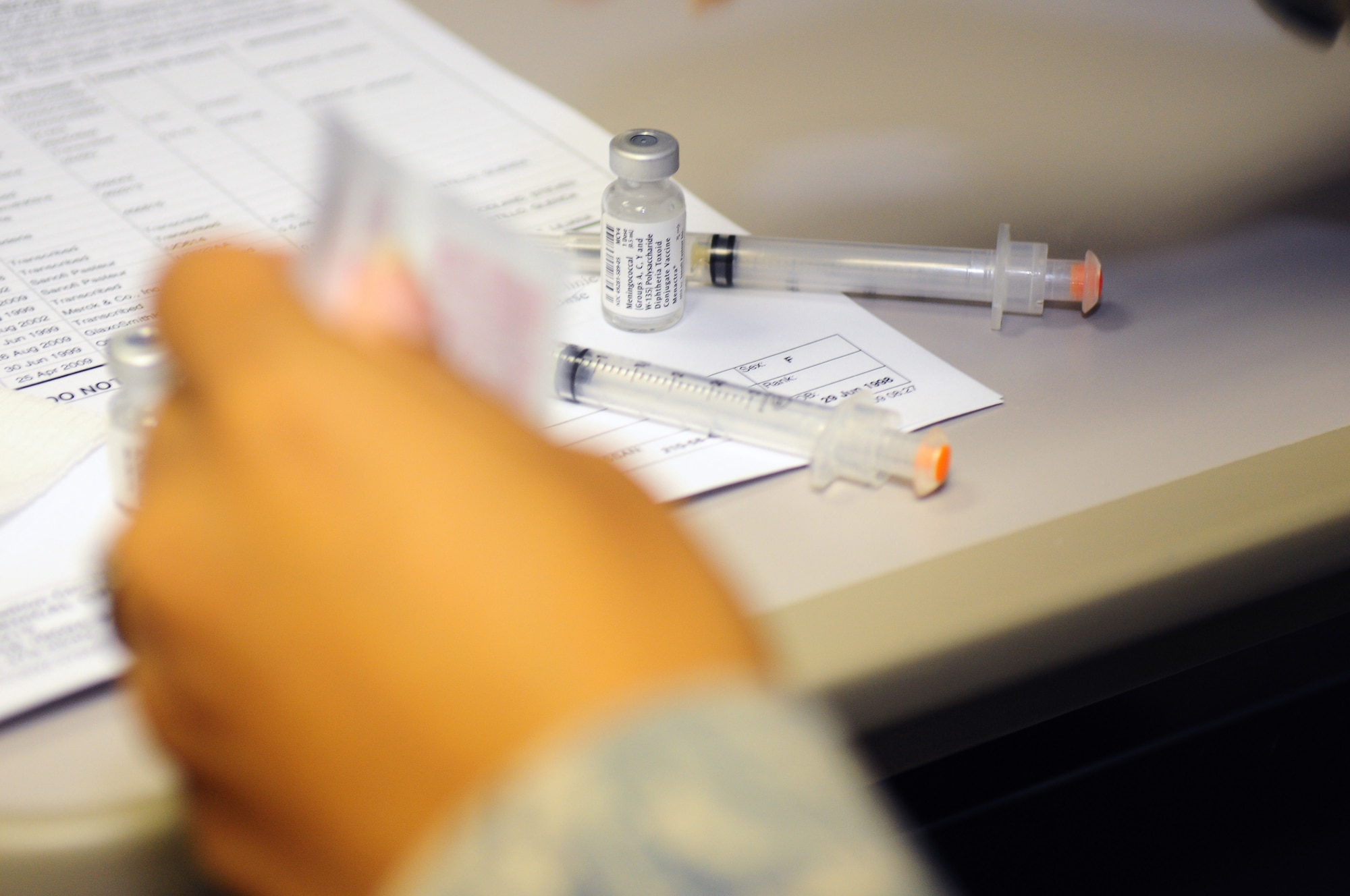 U.S. Air Force Staff Sgt. Glenda Castillo, a medical technician at the 86th Medical Group, prepares syringes to administer immunizations to patients, Ramstein Air Base, Germany, Aug. 26, 2009. "It is really busy around here with school about to start and the beginning of flu season coming up,"  Sergeant Castillo said. (U.S. Air Force photo by Staff Sgt. Jocelyn Rich)