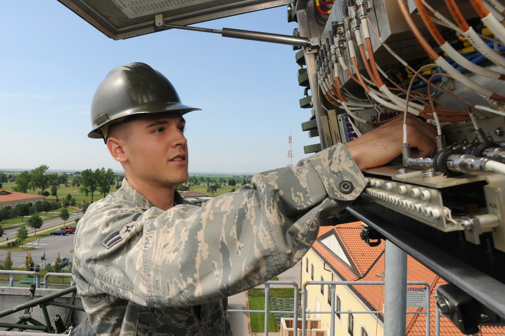 Airman 1st Class Benjamin Cristofich, 603rd Air Control Squadron radar maintainer, performs an antenna-receiver interface check on an AN/TPS-75 Radar System at the squadron's compound Aug. 6, 2009. The 603rd ACS mission is to operate a mobile unit capable of providing radar control and surveillance within a designated area, to collect, display, and disseminate information of aerial activity and to provide radar coverage for the control of air forces. (U.S. Air Force photo/ Staff Sgt. Patrick Dixon)