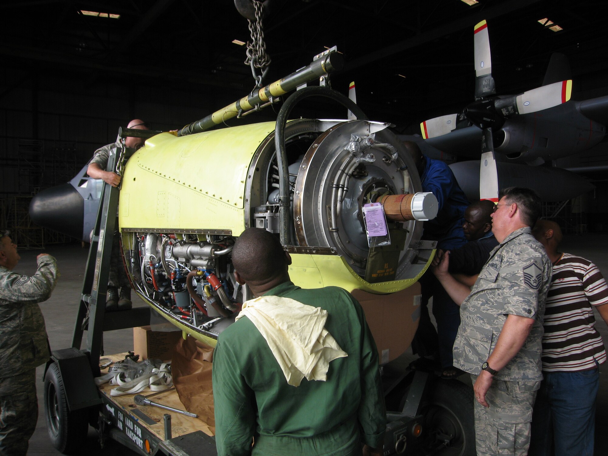 Master Sgt. Jim Goostree, a member of the Tennessee Air National Guard’s 118th Airlift Wing, examines the engine of a Nigerian C-130 as part of the effort to restore the aircraft to flying condition.  Once able to fly, it will go to a repair Depot in Europe for a more extensive overhaul.  The mission is part of an ongoing Military-to-Military engagement between 17th Air Force (U.S. Air Forces Africa) and the West African nation.  (U.S. Air Force photo by Lt. Col. David MacKenzie)