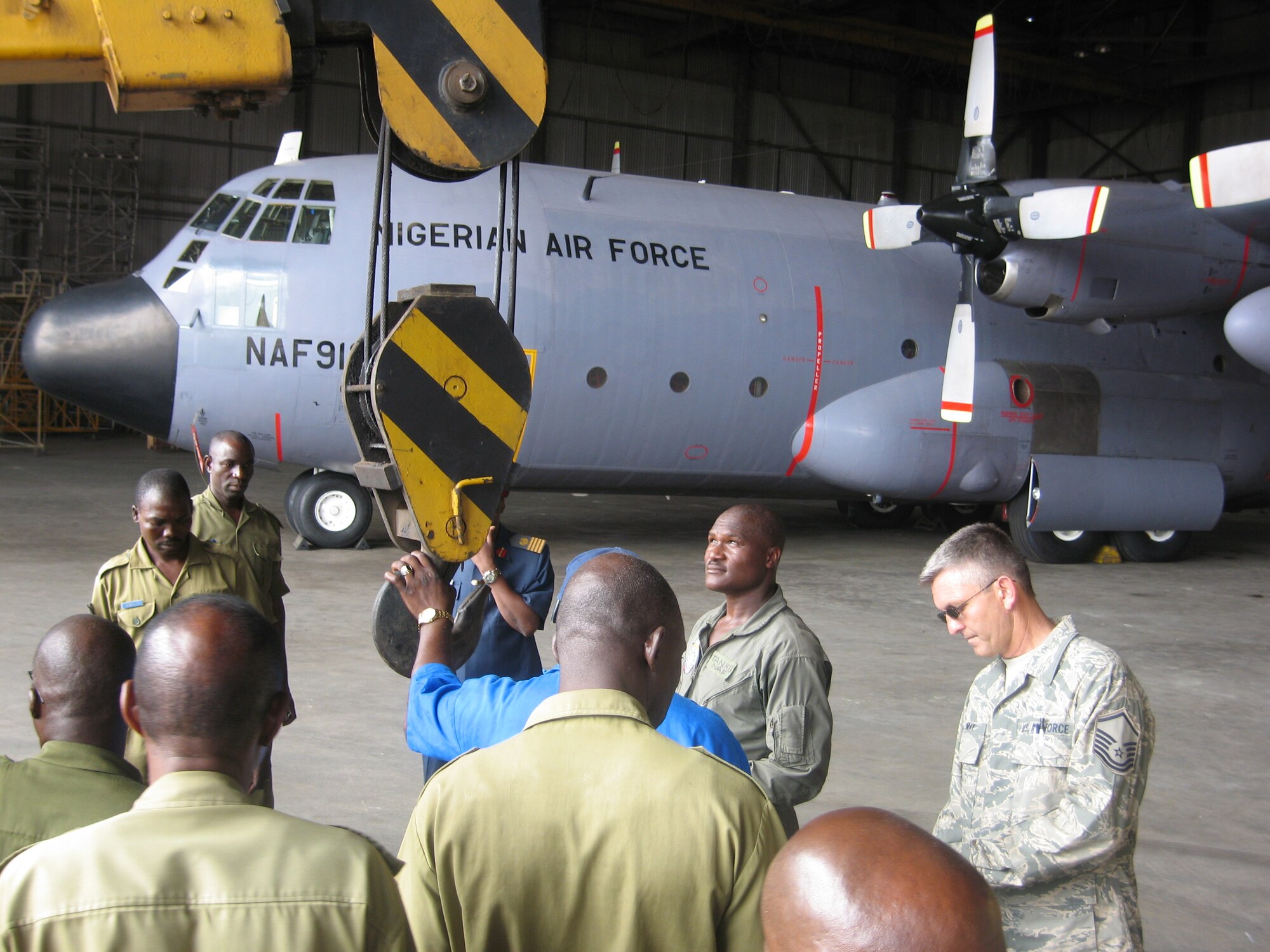 Master Sgt. Christopher May of the Tennessee Air National Guard helps to restore one of Nigeria's C-130 transport aircraft to flying condition as part of an ongoing Military-to-Military engagement between 17th Air Force (U.S. Air Forces Africa) and the West African nation.  (U.S. Air Force photo by Lt. Col. David MacKenzie)