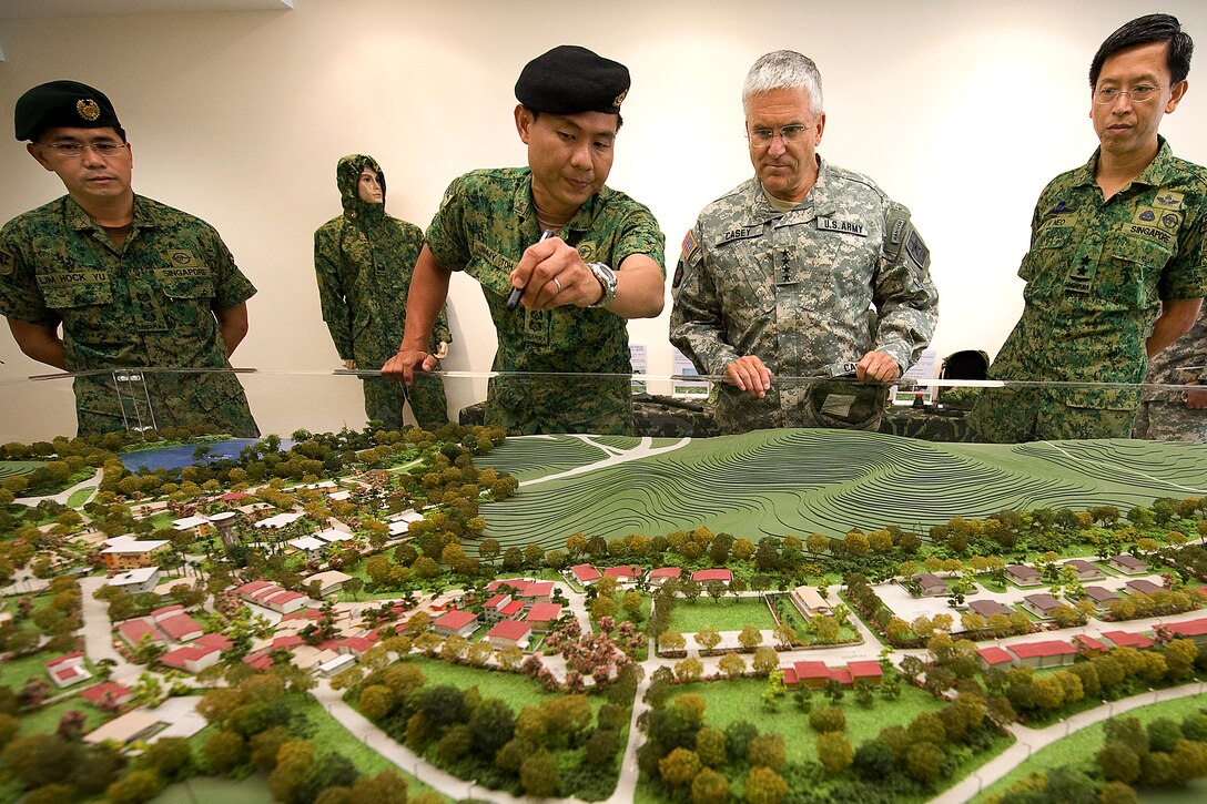 Singapore Army Lt. Col. Jimmy Toh briefs U.S. Army Gen. George W. Casey Jr., Army chief of staff, about Singapore's Murai Urban Warfare Training Facility, Aug. 26, 2009.