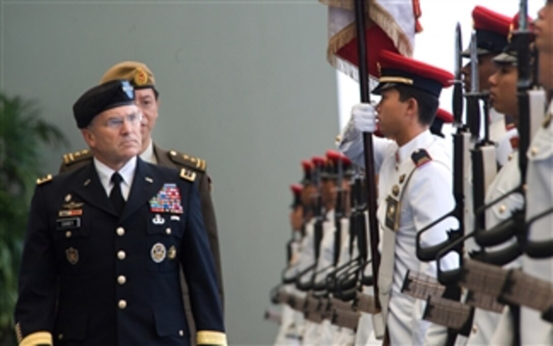 Chief of Staff of the Army Gen. George W. Casey Jr. inspects the Guard-of-Honor at the Ministry of Defense in Singapore on Aug. 26, 2009.  