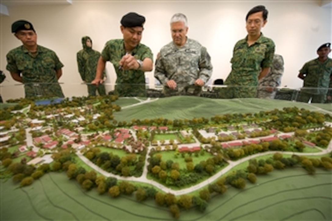 Singapore army Lt. Col. Jimmy Toh briefs the Chief of Staff of the Army Gen. George W. Casey Jr. about the Murai Urban Warfare Training Facility in Singapore on Aug. 26, 2009.  