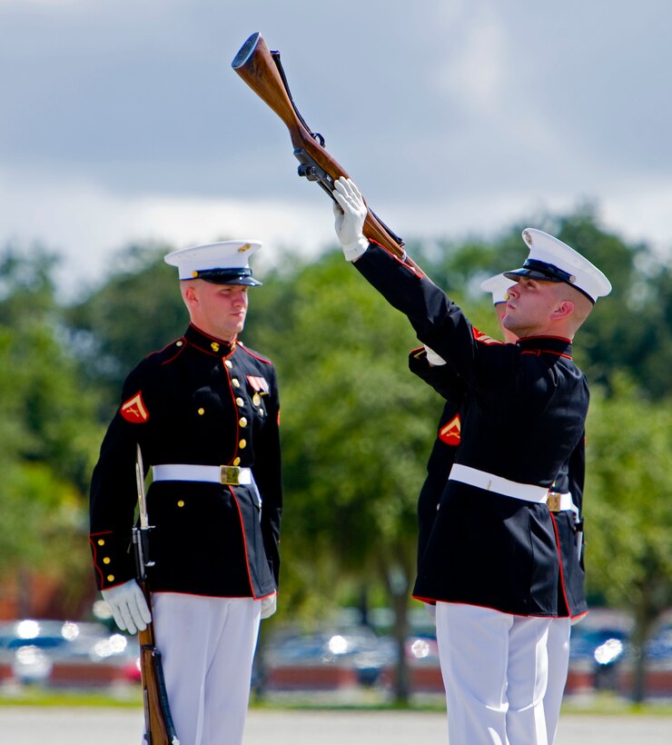 Cpl. Kevin Courtney, Silent Drill Platoon, inspects the rifle of his Marine during the Battle Color Ceremony at Marine Corps Recruit Depot Parris Island, S.C., Aug. 26.
