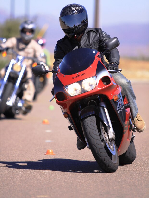 Cpl. Davy V. Duca, helicopter mechanic, Marine Medium Helicopter Training Squadron 164, 3rd Marine Air Wing, corners cones during the hands-on portion of Camp Pendleton’s Basic Riders Course near the front gate, Aug. 26.