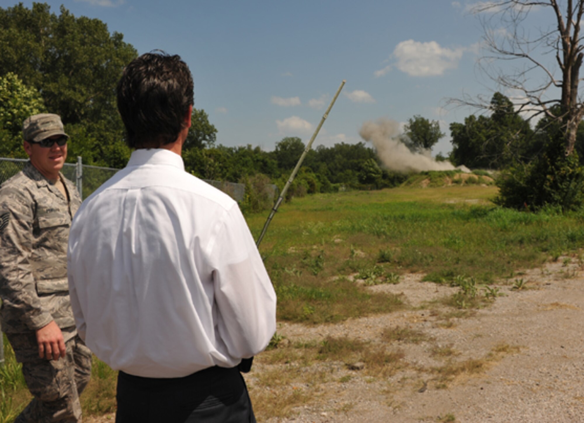 A member of the community is given a chance to set off a small charge during a tour designed to explain various technical skills used by the Air Force Reserve.  (U.S. Air Force photo/Maj. Stan Paregien)