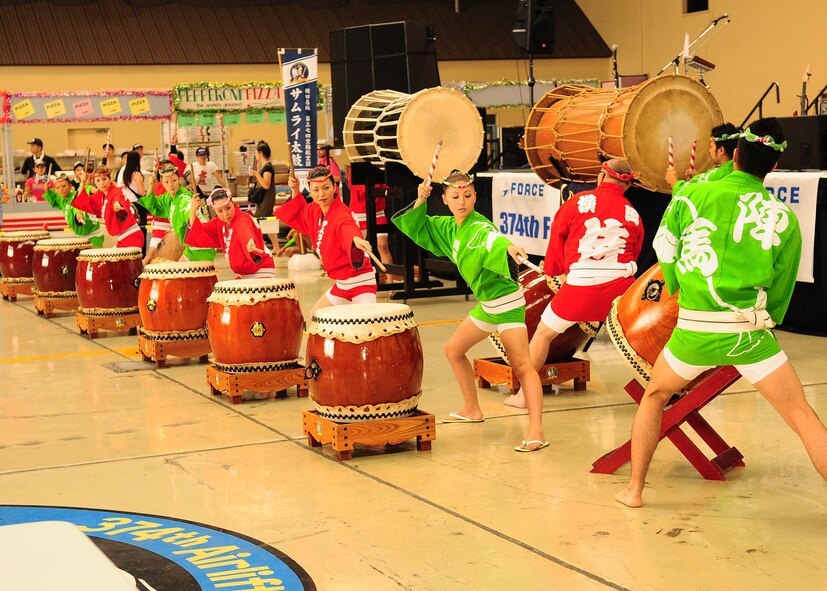 YOKOTA AIR BASE, Japan -- The Yokota Samurai and Hachioji Jinba Daiko drummers entertain festival goers Aug 22 during the first day of the two-day Japanese-American Friendship Festival Aug. 22. More than 80,000 people attended the first day. In addition to static displays and live music, the festival offered a variety of American and Japanese food items. The festival is designed to bolster the bi-lateral relationship shared by the United States and Japan.(U.S. Air Force photo/Airman 1st Class Sean Martin)