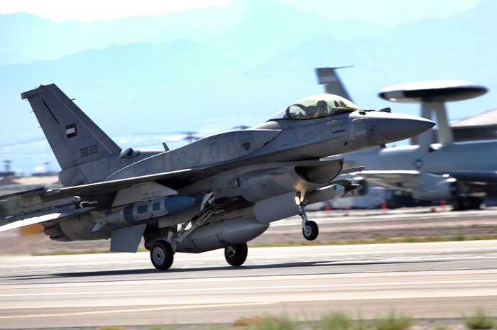 NELLIS AIR FORCE BASE Nev.-- An F-16E from Al Dhafra Air Base, United Arab Emirates takes off for a training mission during Red Flag 09-5 Aug. 26.  This is the first time the nation has participated in Red Flag--a realistic air combat training exercise conducted over the 15,000-square-mile Nevada Test and Training Range north of Las Vegas. The two-week exercise is administered through the 414th Combat Training Squadron at Nellis Air Force Base and is just one in a series of advanced training programs offered by the U.S. Air Force Warfare Center. In addition to the United Arab Emirates, U.S. Air Force, Navy and Marines Corps units from Nevada, Massachusetts, Utah, Louisiana, California, Washington, Oklahoma, Florida and Kansas; as well as allied forces from Italy are participating in Red Flag 09-5.  The exercise ends Sept. 4. (U. S. Air Force photo by Tech. Sgt. Michael R. Holzworth/Released)