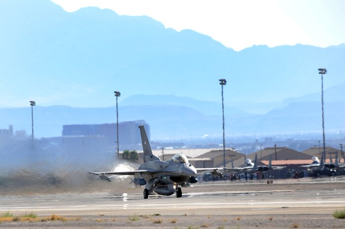 NELLIS AIR FORCE BASE Nev.-- An F-16E from Al Dhafra Air Base, United Arab Emirates takes off for a training mission during Red Flag 09-5 Aug. 26.  This is the first time the nation has participated in Red Flag--a realistic air combat training exercise conducted over the 15,000-square-mile Nevada Test and Training Range north of Las Vegas. The two-week exercise is administered through the 414th Combat Training Squadron at Nellis Air Force Base and is just one in a series of advanced training programs offered by the U.S. Air Force Warfare Center. In addition to the United Arab Emirates, U.S. Air Force, Navy and Marines Corps units from Nevada, Massachusetts, Utah, Louisiana, California, Washington, Oklahoma, Florida and Kansas; as well as allied forces from Italy are participating in Red Flag 09-5.  The exercise ends Sept. 4. (U. S. Air Force photo by Tech. Sgt. Michael R. Holzworth/Released)