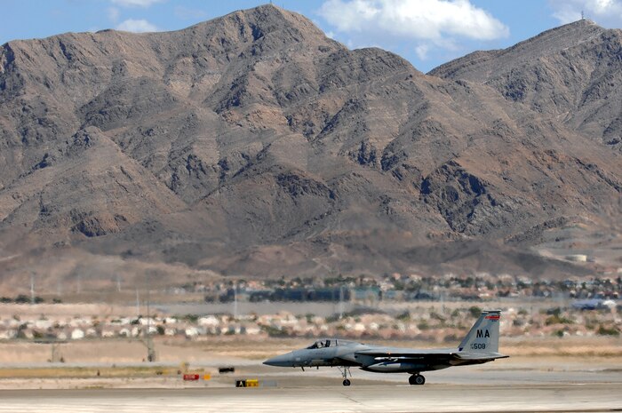 NELLIS AIR FORCE BASE, Nev.-- An F-15C from 104th Fighter Wing, Westfield, Mass., sits at the end of the runway prior to a Red Flag 09-5 training mission Aug. 24. Red Flag is a realistic air combat training exercise conducted over the 15,000-square-mile Nevada Test and Training Range north of Las Vegas. The two-week exercise is administered through the 414th Combat Training Squadron at Nellis Air Force Base and is just one in a series of advanced training programs offered by the U.S. Air Force Warfare Center. U.S. Air Force, Navy and Marines Corps units from Nevada, Massachusetts, Utah, Louisiana, California, Washington, Oklahoma, Florida, and Kansas are participating in Red Flag 09-5 along with allied forces from Italy and the United Arab Emirates. The exercise ends Sept. 4. (U.S. Air Force photo by Airman 1st Class Brett Clashman/Released)