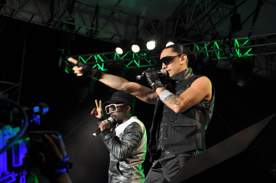 KANEOHE BAY, Hawaii -- The Black Eyed Peas perform hit songs Aug. 15 during BayFest 2009 here The show, which attracted 15,000 Marines, Airmen, Soldiers, Sailors, Coastguardsmen, and local residents and tourists, was sold out three weeks prior. Lauded as "the biggest entertainment event in Hawaii," BayFest is an annual event featuring rides, games, fireworks, and live music organized by Marine Corps Community Services. Proceeds from this event enhance the quality of life for military servicemembers and their families. (U.S. Air Force photo/Staff Sgt. Carolyn Viss) 