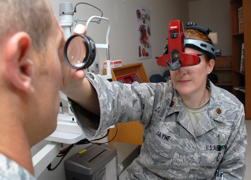 HICKAM AIR FORCE BASE, Hawaii -- Maj. Tara Jayne, 15th Aeromedical-Dental Squadron optometrist, uses a bionauclor indirect ophthalmoscope to detect the diseases caused by macular degeneration. Smoking and over exposure to ultraviolet rays have some of the elements that may cause diseases in the eye. Major Jaybe has spent more than eight years as an optometrist in the Air Force. The only optometrist on Hickam, she has been on five humanitarian trips to the Dominican Republic, Philippines and Thailand during her career. Her next assignment will take her to Ramstein Air Base, Germany. (U.S. Air Force photo/Staff Sgt. Mike Meares)
