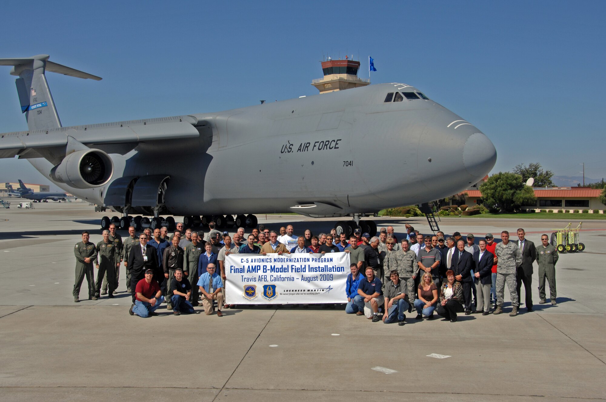 TRAVIS AIR FORCE BASE, Calif. -- Members of both Team Travis and Lockheed Martin stand in front ast C-5B Galaxy to be upgraded under the Avionics Modernization Program. (U.S. Air Force photo/Nan Wylie)