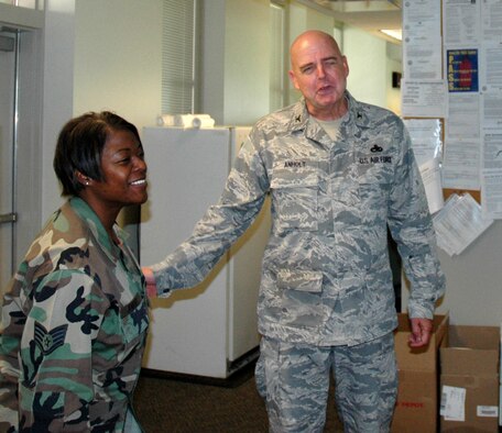 MCCHORD AIR FORCE BASE, Wash.- Staff Sgt. Jorina Jenkins, a planner and scheduler with the 62nd Maintenance Operations Squadron here, left, shares a laugh with Col. Bill Anholt, the new Air Force Reserve 446th Maintenance Group commander here during his walk through of base maintenance headquarters, Aug. 20. Colonel Anholt plans to maintain the strong working relationship between the active duty and Reserve maintenance units, re-emphasizing the Team McChord concept. (U.S. Air Force photo/Tech. Sgt. Jake Chappelle)
