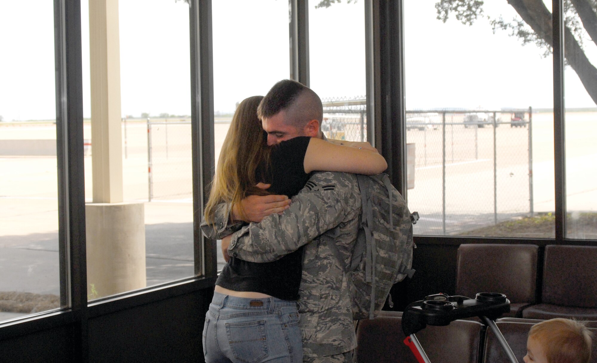 Air Force Airman First Class Robert Peacock, 17th Security Forces Squadron,  gets a welcome home hug from his wife on Aug. 21. (U.S. Air Force by Robert D. Martinez)