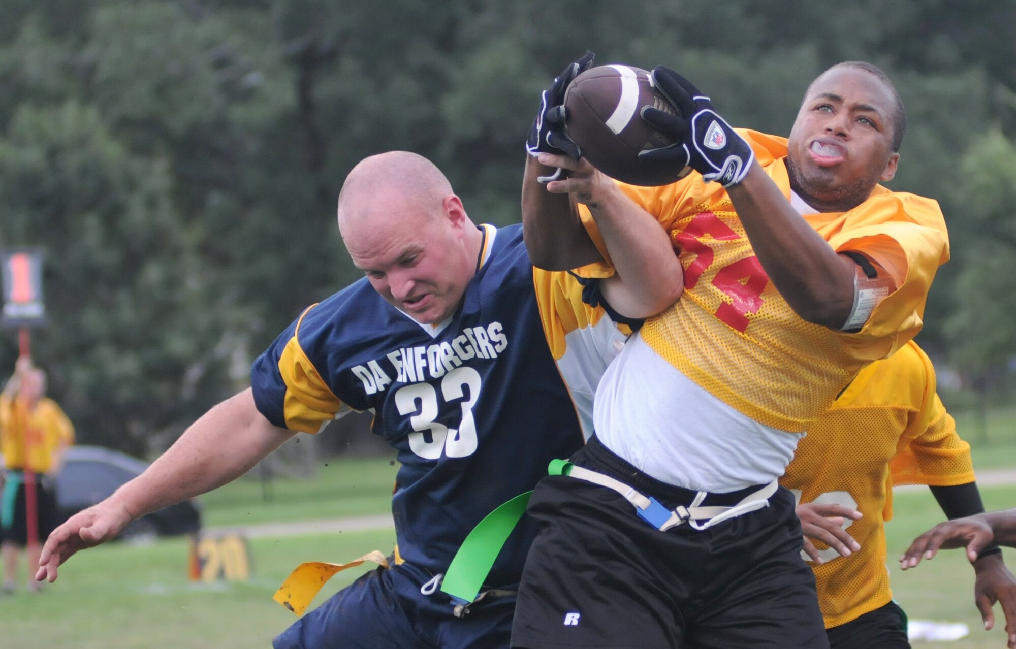 Jason Williams, left, 81st SFS, tries to interrupt Raven Mays from completing a pass for MARDET during the finals of the preseason flag football tournament, Aug. 20.  The cops managed to shut out MARDET, 6-0.  (U.S. Air Force photo by Kemberly Groue)