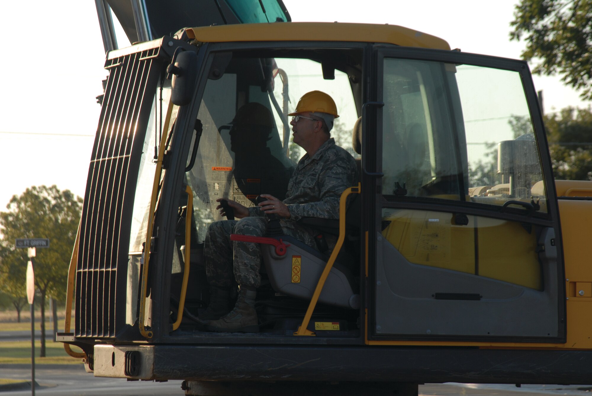 Col. David Rearick, 17th Training Wing vice commander, mans the controls of an excavator to begin the demolition of the chapel . (U.S. Air Force photo by Stafff Sgt. Laura R. McFarlane)