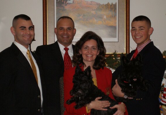 Col. Mohammed "Mo" Khan and his wife Lisa, pose for a family photo with sons Mohammed, left, and Simeon, right along with their family pets Nellie and Abby. (Courtesy photo)   