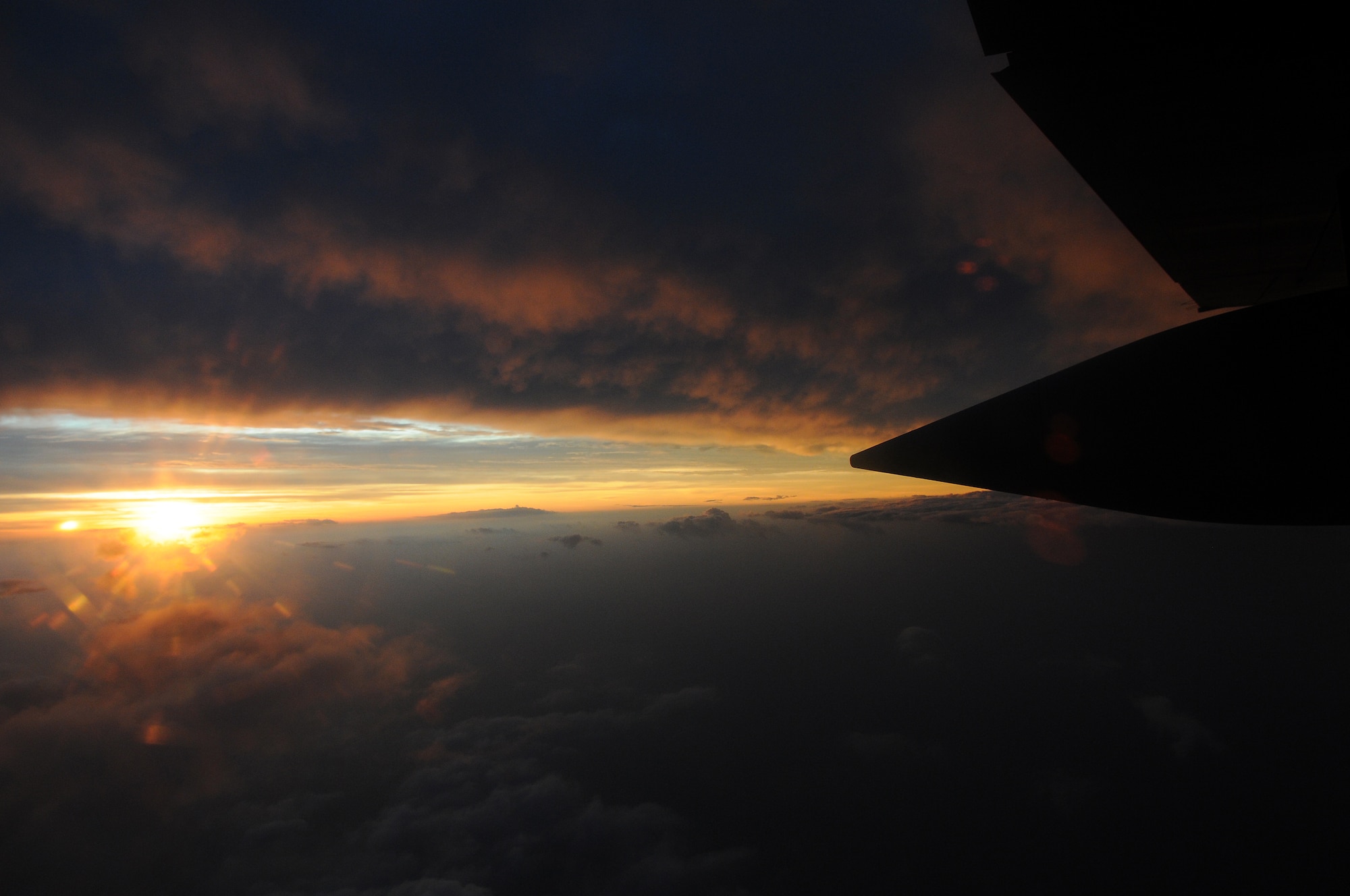 The sun rises just as the 53rd Weather Reconnaissance "Hurricane Hunters," make their third pass through the eye of Category 1 Hurricane Bill Aug. 23 near Nova Scotia, Canada. The Air Force Reserve Hurricane Hunters of the 403rd Wing at Keesler Air Force Base, Miss fly 24-hours-a-day, collecting data inside the heart of Mother Nature's fury (U.S. Air Force Photo by Staff Sgt. Tanya King)