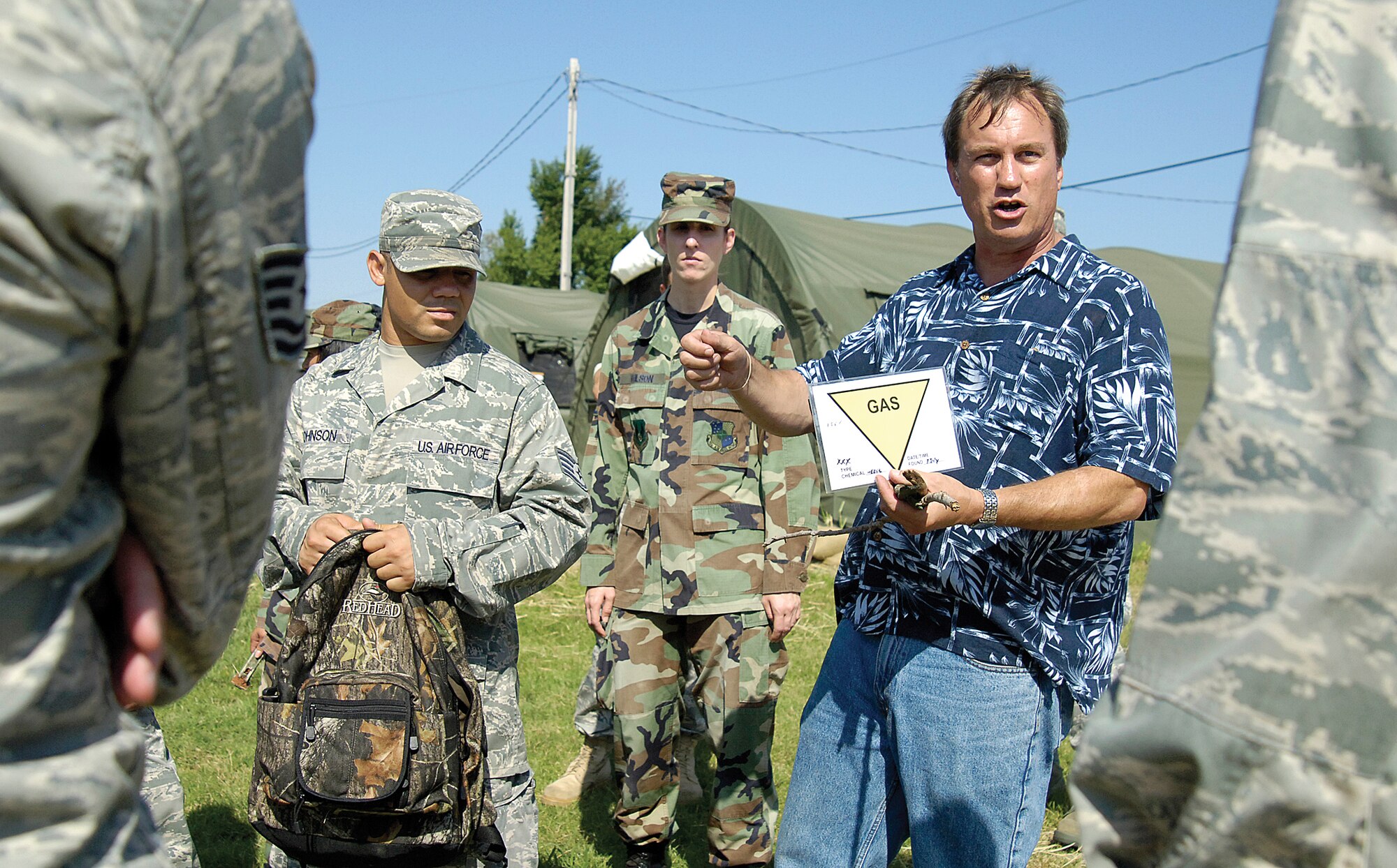 Continuing training for deployments, enemy attacks and survival in hostile environments, Tinker Airmen gear up for a War Wagon exercise at Glenwood Training Area this week. The exercise, that ends today, focused on deployed operations. At Glenwood Training Area, exercise controller Paul Logan trains 72nd Air Base Wing Airmen Aug. 25 on post-attack reconnaissance. (Air Force photo by Margo Wright)