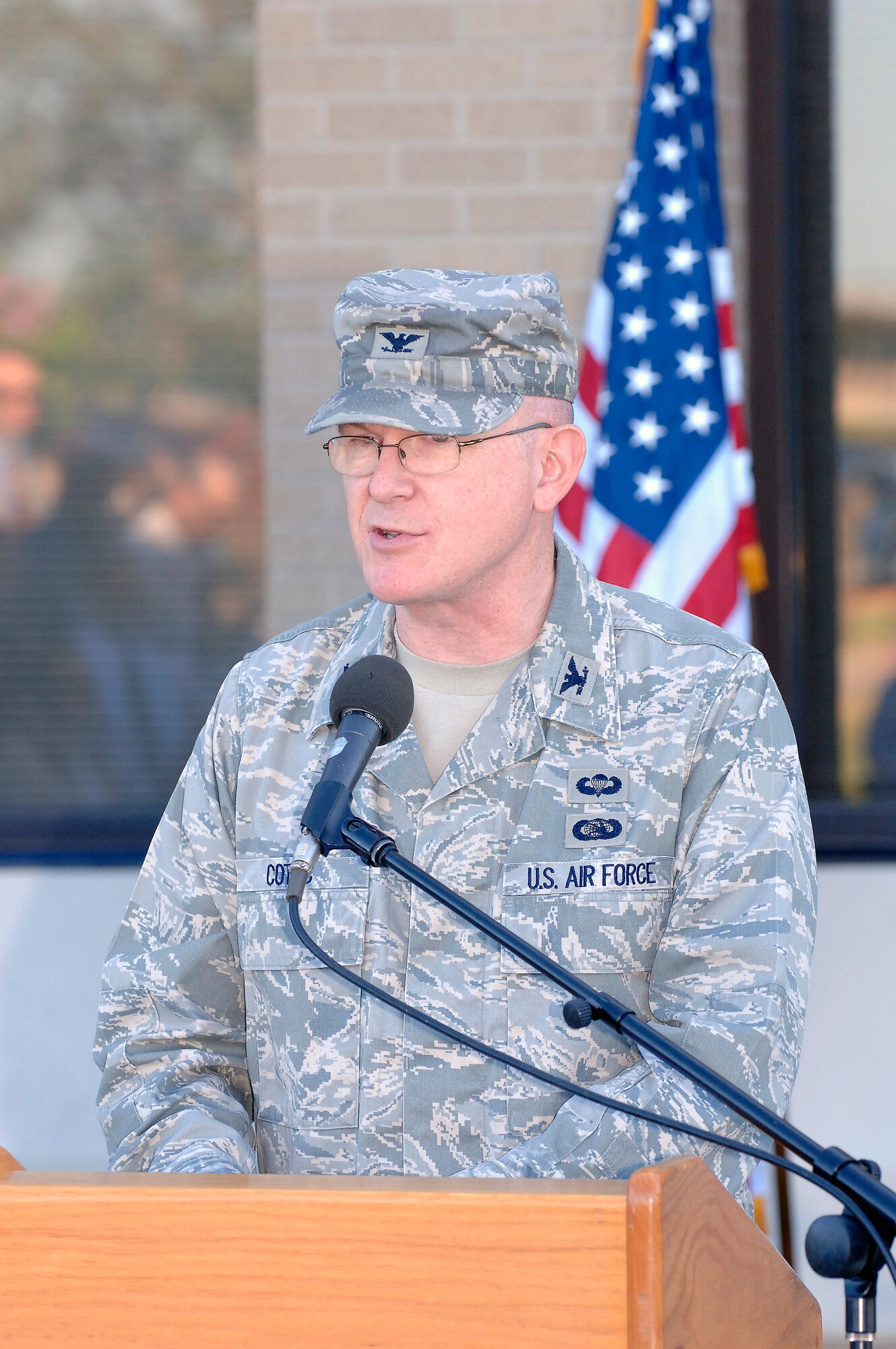 Col. Christopher Cotts, 38th Cyberspace Engineering Group commander, speaks at a a ceremony here Aug. 21 when the group became part of the newly-formed 24th Air Force. (Air Force photo by Dave Faytinger) 