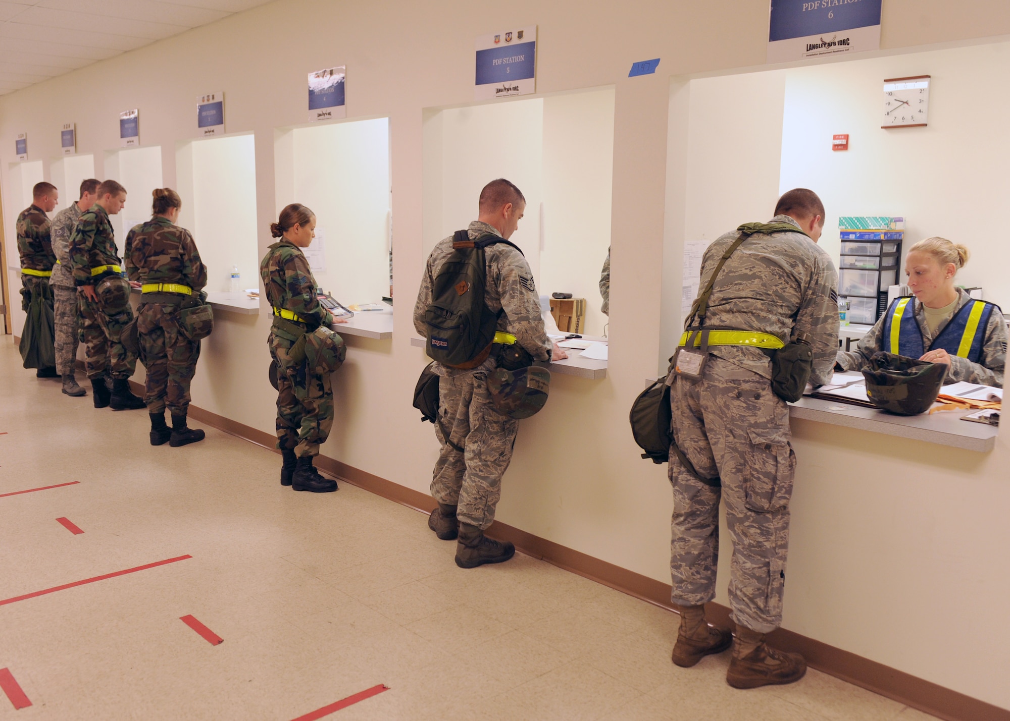 LANGLEY AIR FORCE BASE, Va. -- Airmen process through a deployment line during a Phase I Operational Readiness Exercise here Aug. 27. The ORE is designed to establish Langley's expeditionary readiness and efficiency in deploying Airmen.  More than 2,500 Airmen will be involved in the exercise, which will measure the 1 FW's capabilities on graded, step-by-step guidelines which involve preparing aircraft, cargo and Airmen to deploy seamlessly within an established period of time. (U.S. Air Force photo/Airman1st Class Jonathan Koob)