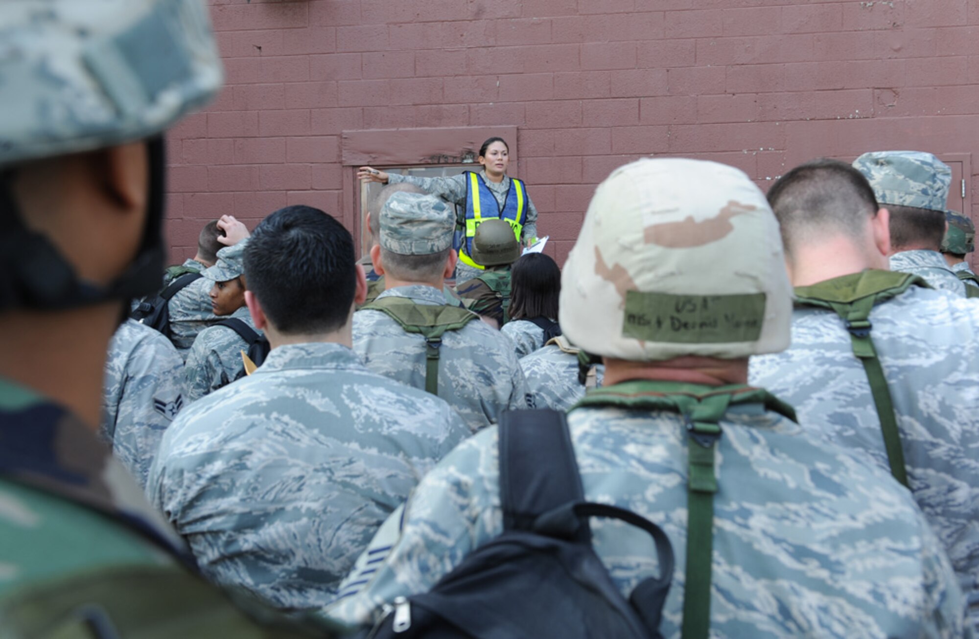 LANGLEY AIR FORCE BASE, Va. -- 1st Lt. Krista Barajas, 1st Force Support Squadron officer in charge, performs roll call during a Phase I Operational Readiness Exercise here Aug. 27. The ORE is designed to establish Langley's expeditionary readiness and efficiency in deploying Airmen. More than 2,500 Airmen will be involved in the exercise, which will measure the 1 FW's capabilities on graded, step-by-step guidelines which involve preparing aircraft, cargo and Airmen to deploy seamlessly within an established period of time. (U.S. Air Force photo/Airman1st Class Jonathan Koob)
